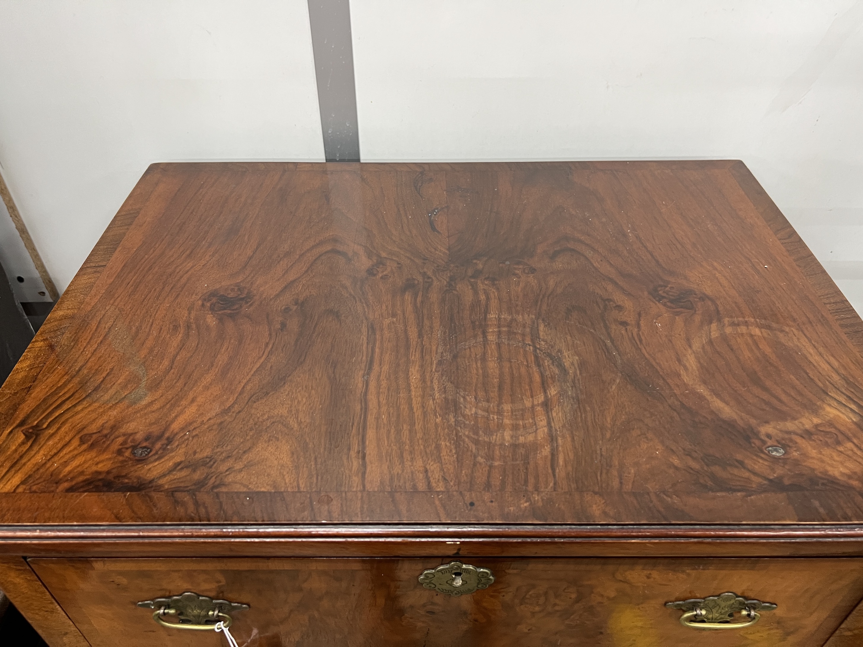 A Queen Anne revival narrow walnut five drawer chest, width 61cm, depth 42cm, height 122cm